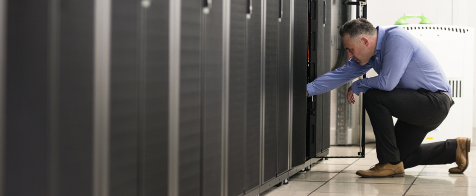 Man does maintenance on data center hardware